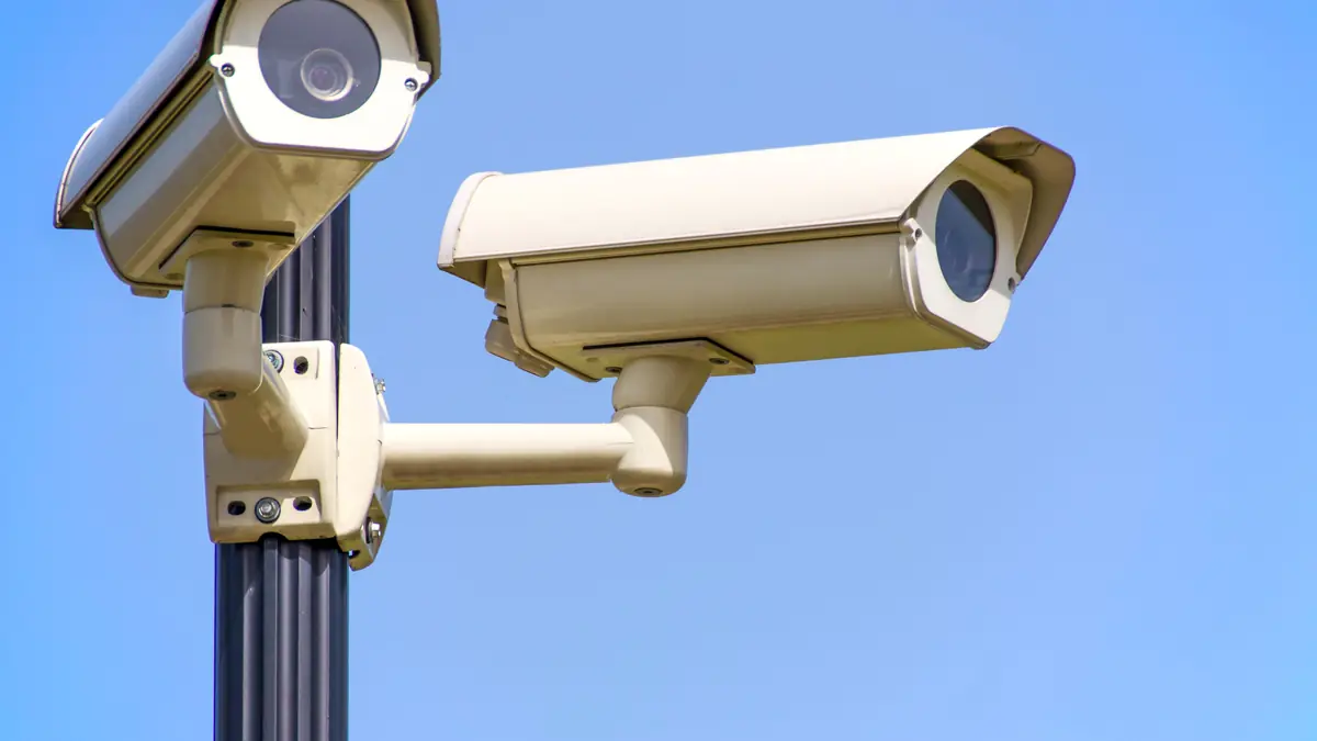 Two CCTV cameras mounted on a pole