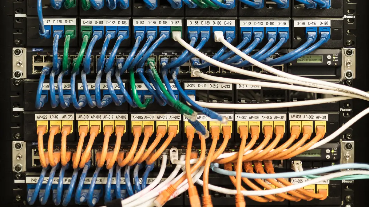 Network cables neatly patched into a server rack